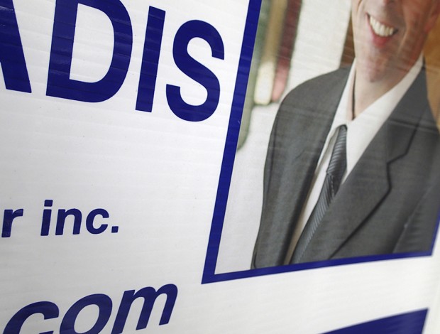 A real estate broker reviewing housing options
