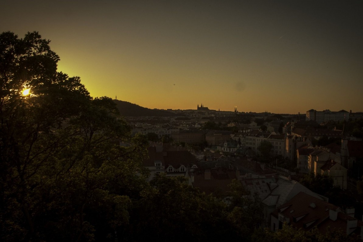 The sun setting over the city skyline of Prague