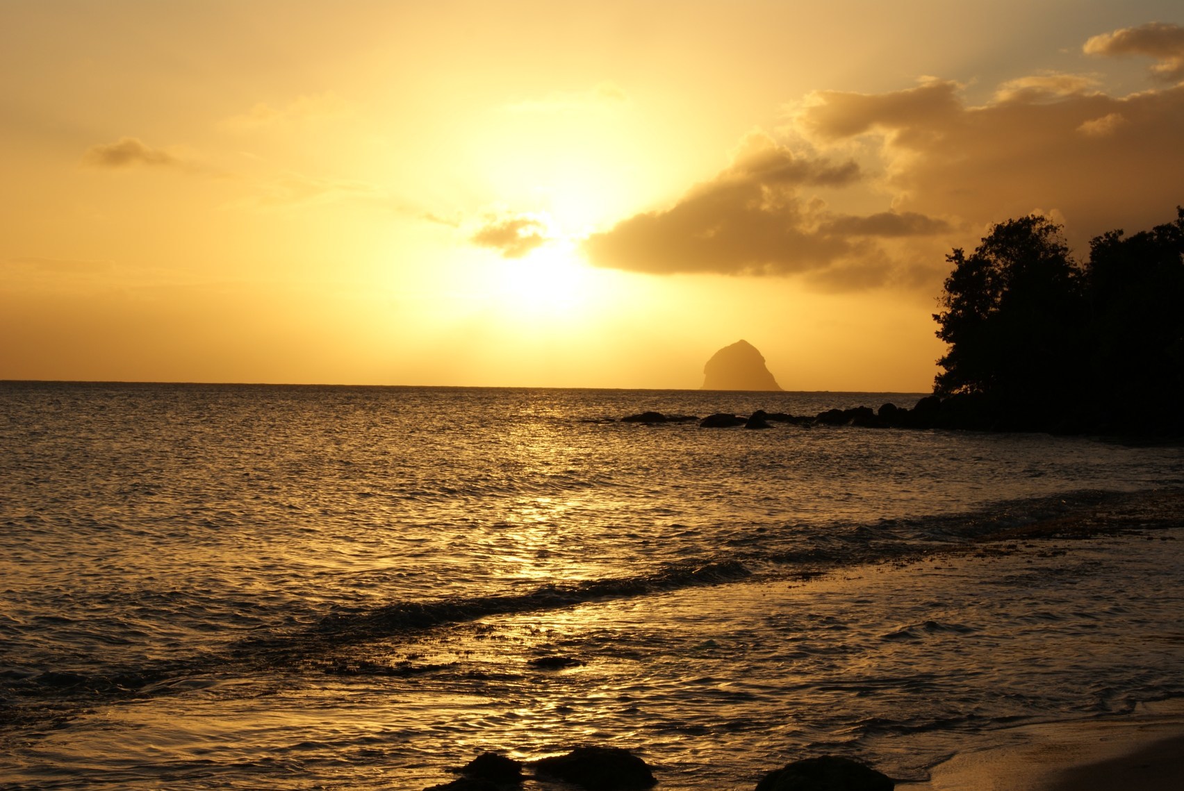 The sun setting over Diamond Rock in Martinique