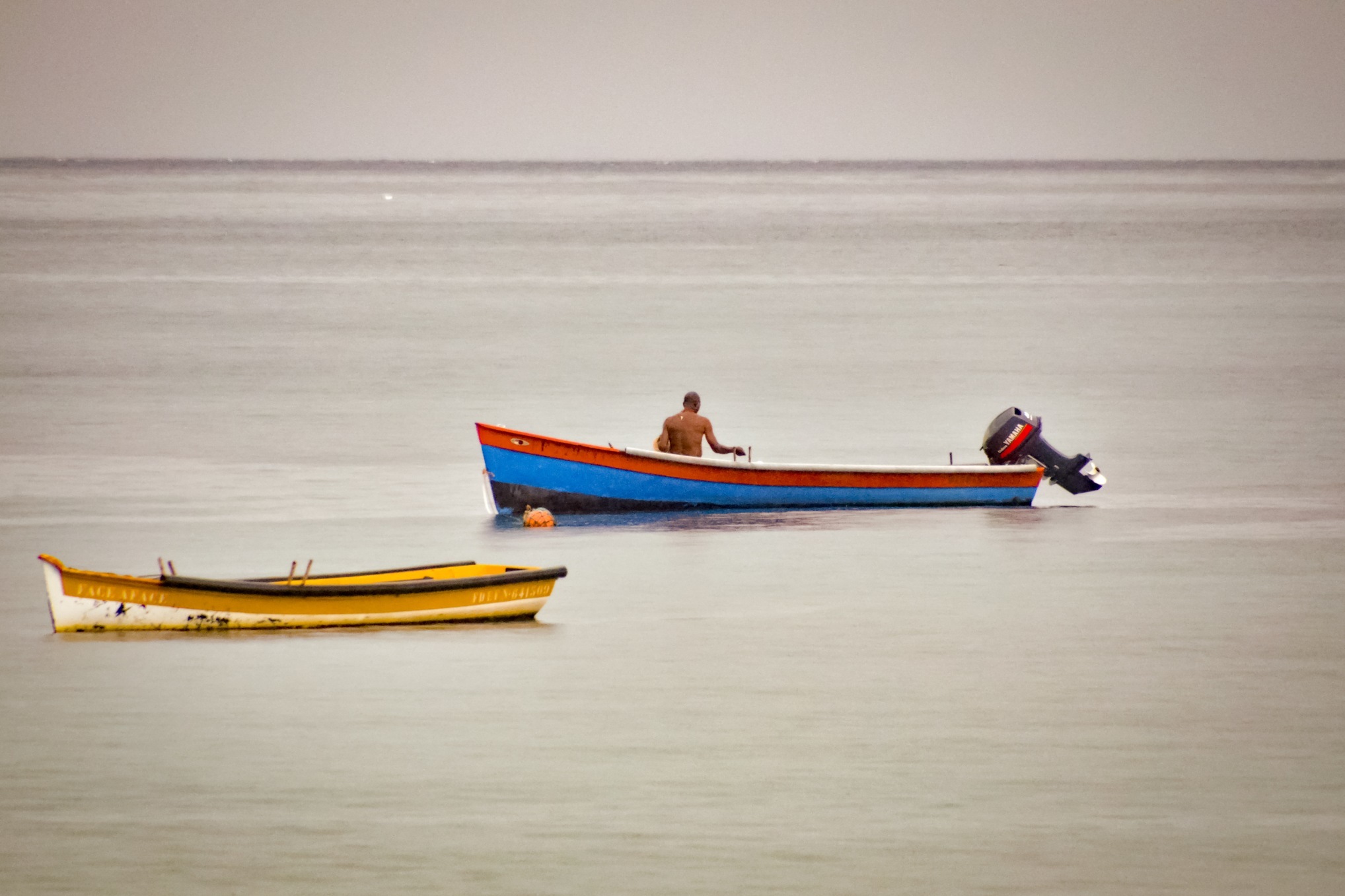 Several boats resting on the water