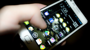 A smartphone held up for navigation on the road
