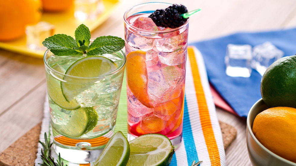 A glass filled with a pink gin cocktail