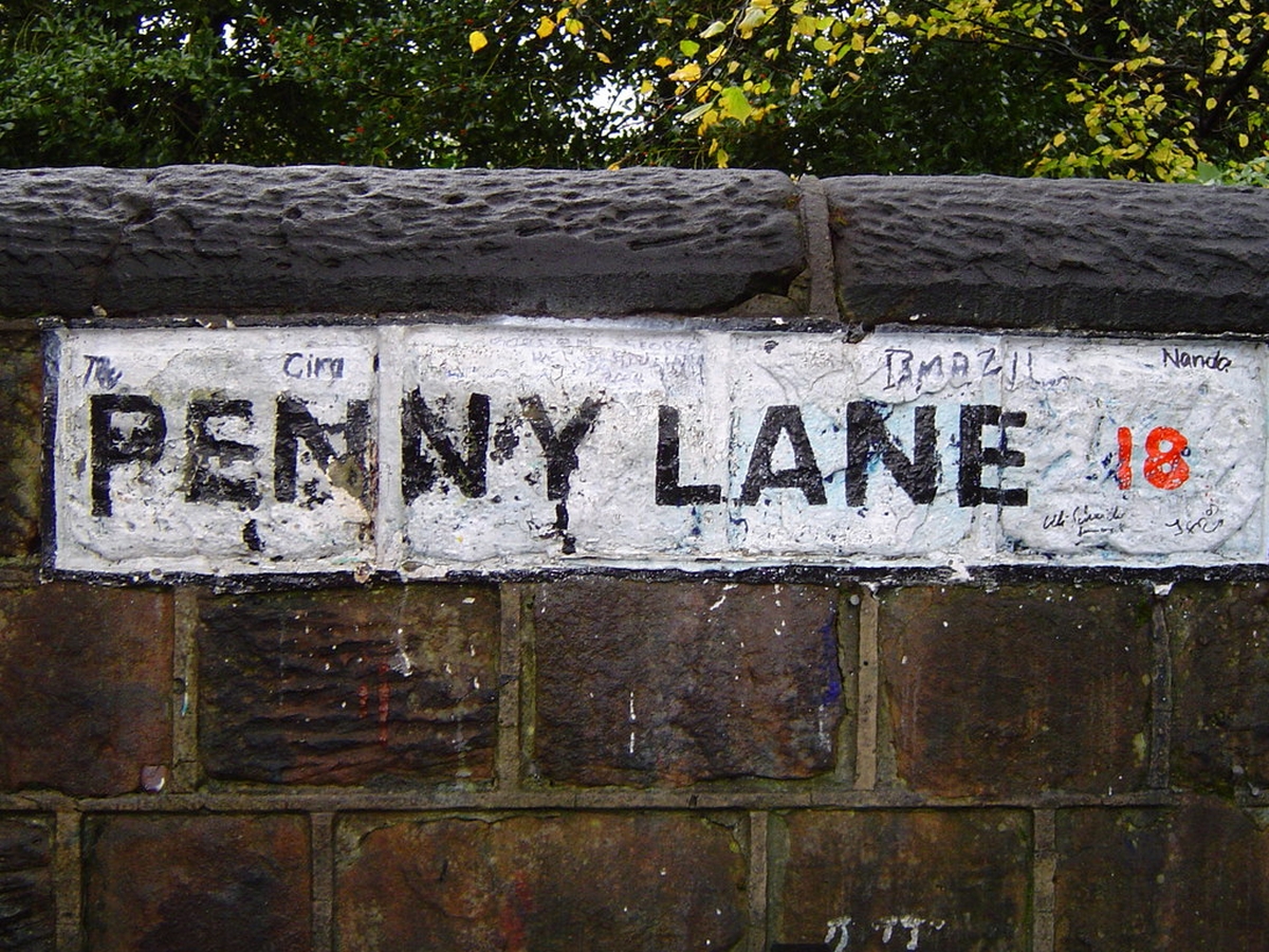 Beatles attractions in Liverpool - A street sign planted on a wall at Penny Lane