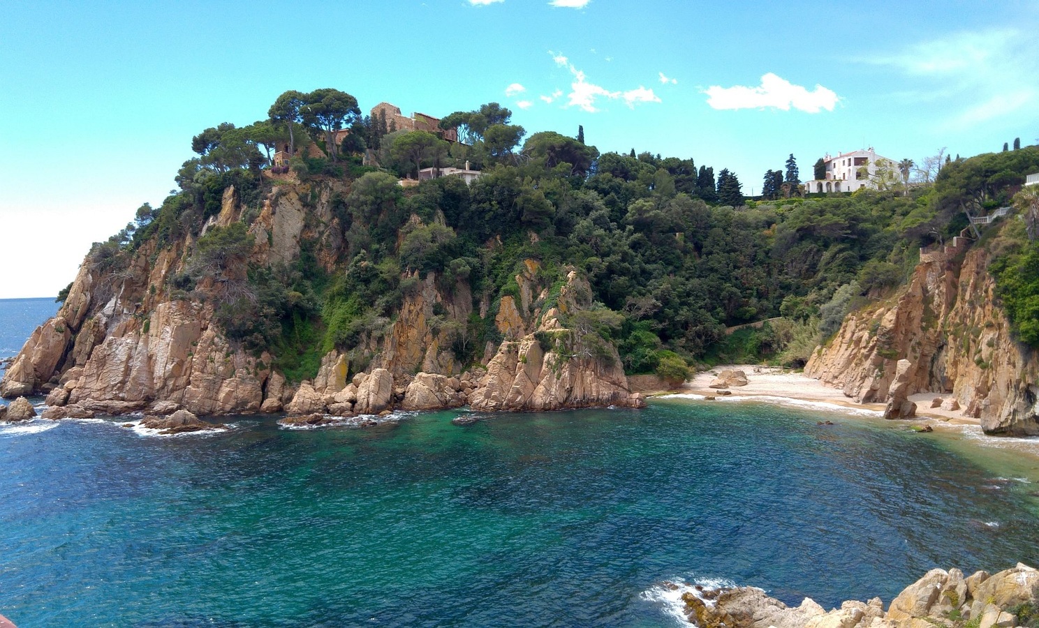 A coastal summer landscape along the water in Costa Brava
