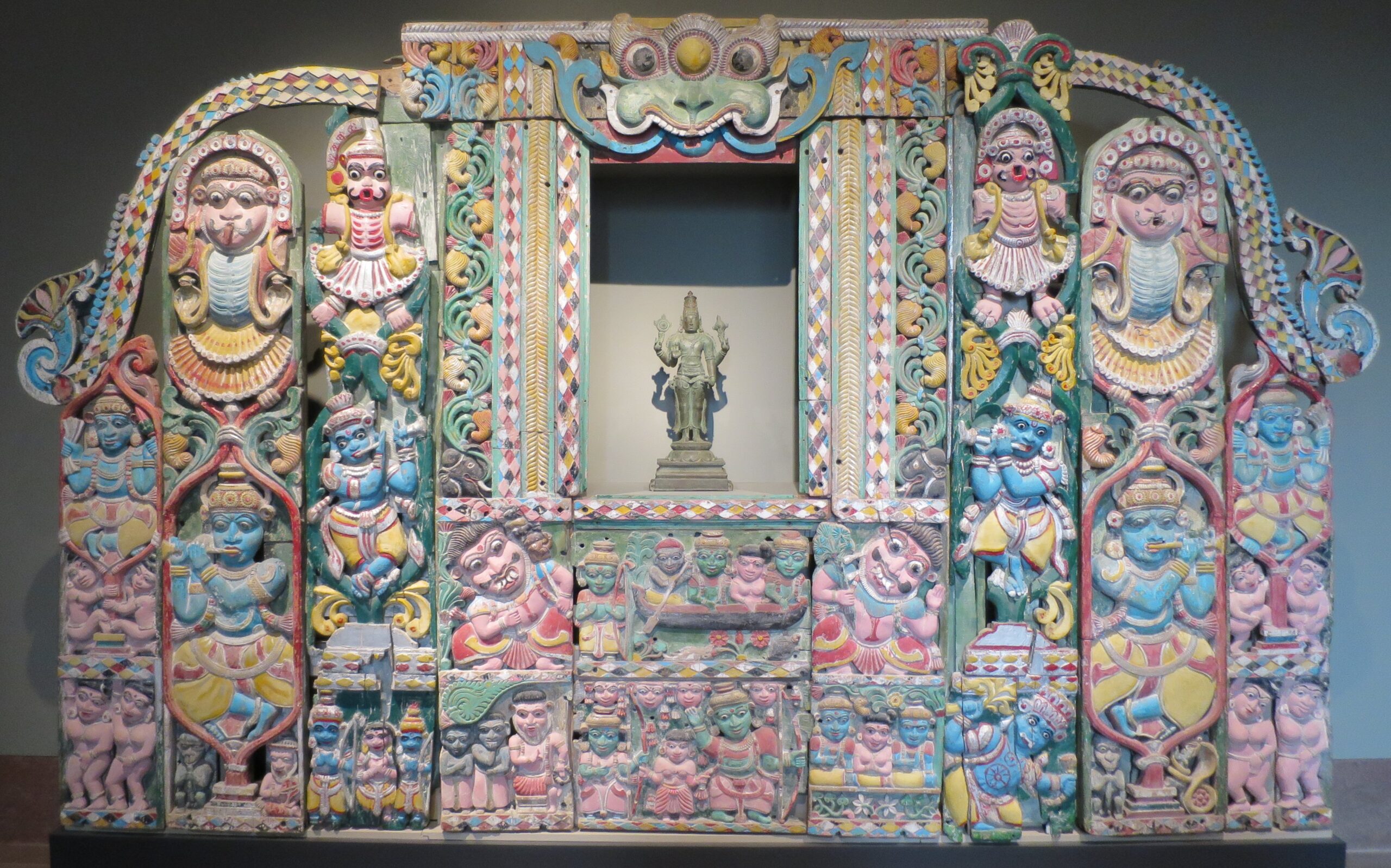 A temple wall displaying scenes of Krishna's life from Kerala