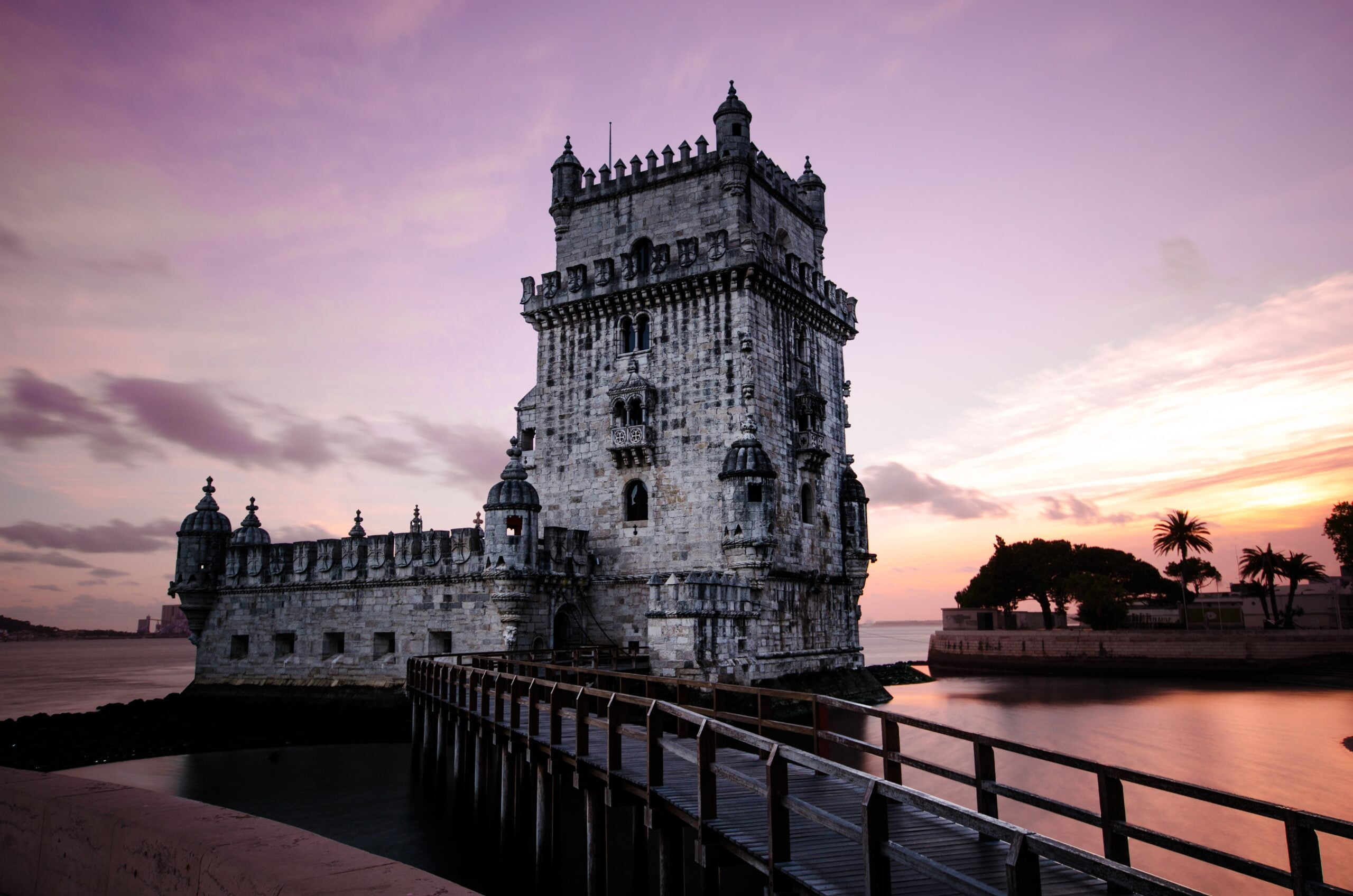 A tower building visible at dusk in Lisbon, Portugal