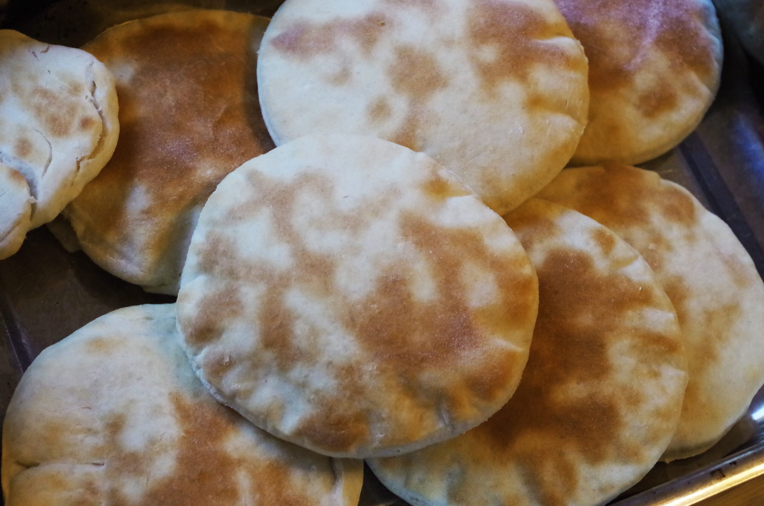 A piece of baked Naan bread