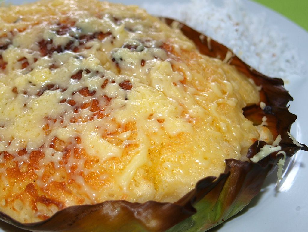 Andrew Zimmern Delicious Destinations Manila -Fluffy rice cake with butter and melted cheese as toppings