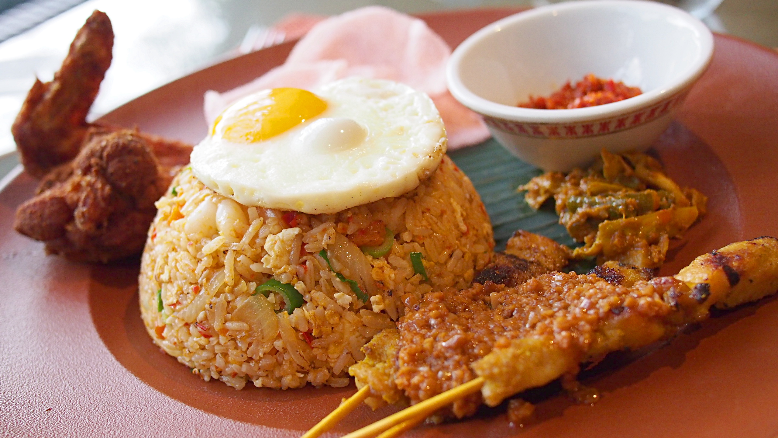 Delicious Destinations Bali - A combo of Pork Barbecue, Fried Chicken and Nasi Goreng toped with egg