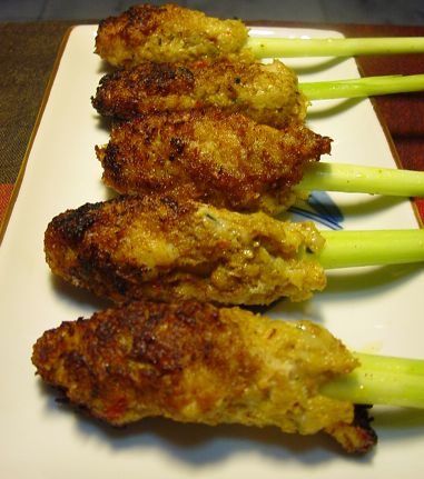 Grilled minced meat with spices wrapped around a stick