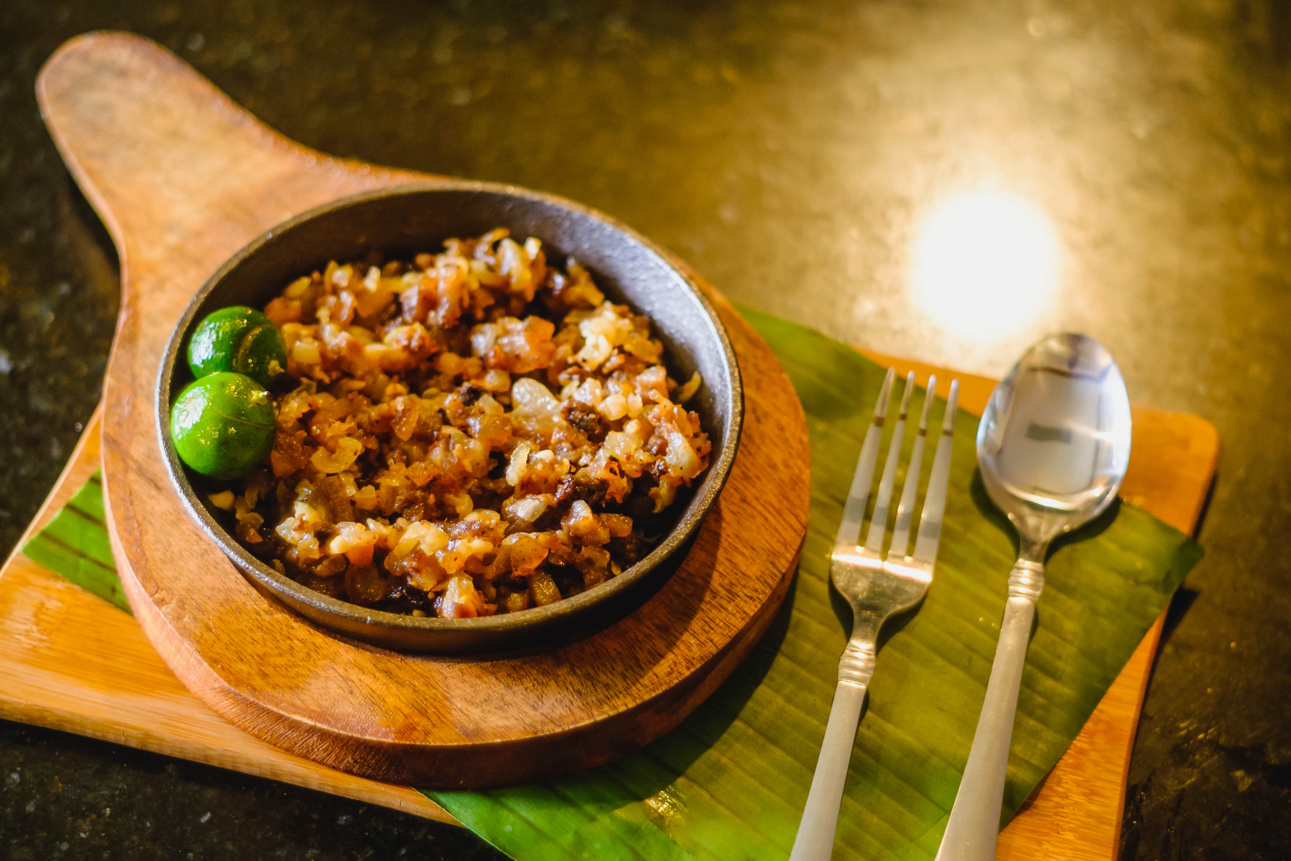 Andrew Zimmern Delicious Destinations Manila - Chopped deep fried pig face, ears, liver and meat