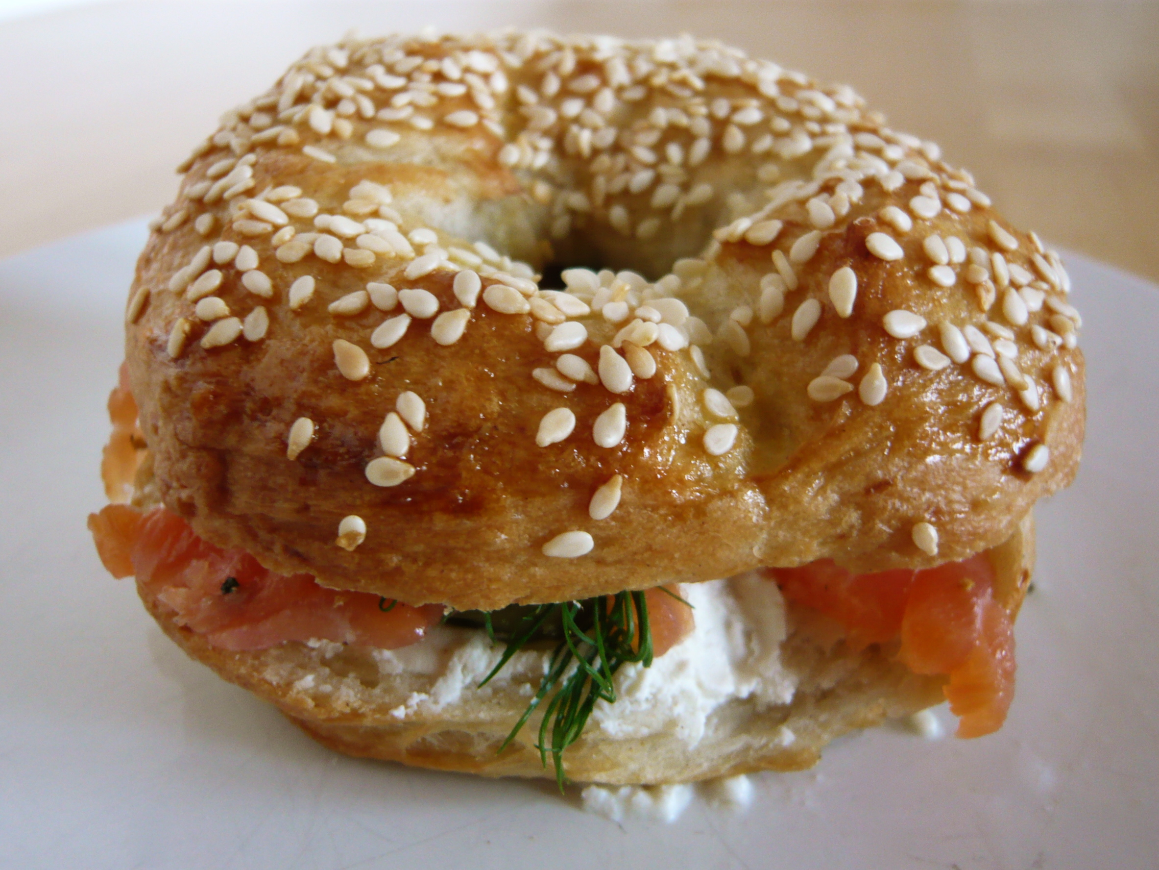 A sandwhich made with toasted Begels, tomato and cream cheese