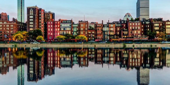 Brownstones of Boston's Back bay neighborhood reflected in the Charles River - photo by Robbie Shade under CC BY 2.0