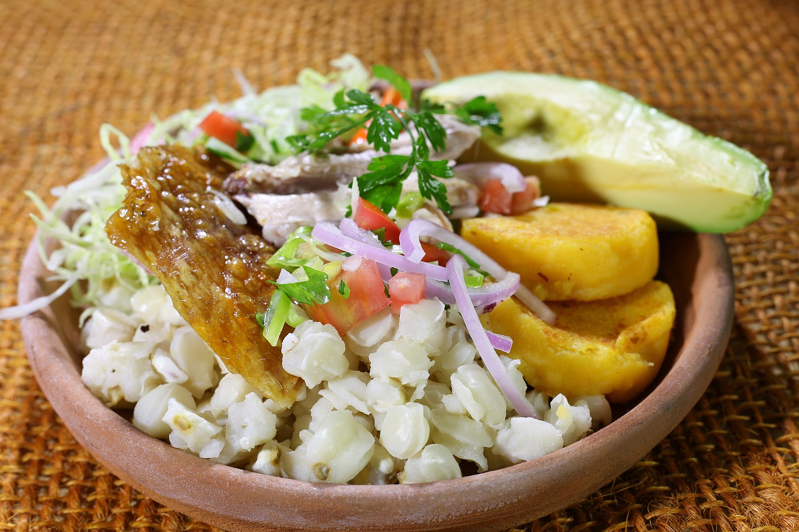Chancho and Llapingachos - photo by amalavida.tv from Ecuador under CC BY-SA 2.0