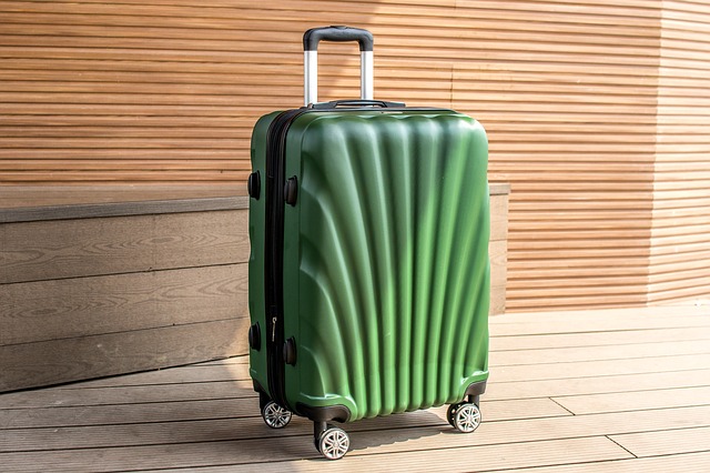 hard-shell wheeled suitcase - photo by huynhdatstc under Pixabay License