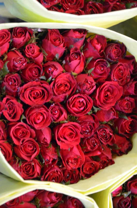 A beautiful bouquet of red roses on sale at Pak Khlong Talad - photo by shankar s. under CC BY 2.0