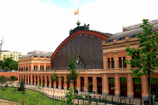 northwest façade of Atocha railway station in Madrid - photo by Manuel M. Vicente from Spain under CC-BY-SA-2.0