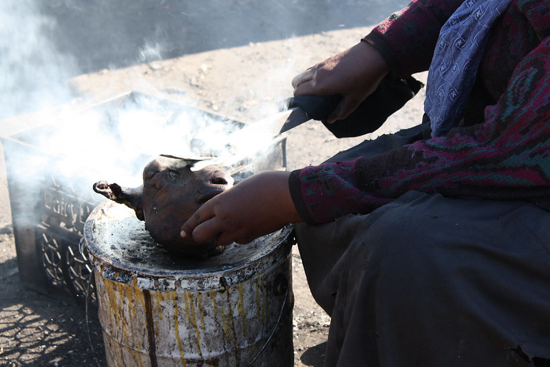 Anthony Bourdain South Africa - A woman making a "smiley" - photo by Kim Nowacki under CC BY-ND 2.0